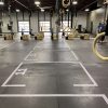 Floor grid decals for fitness centers, safety-focused and scrubber-resistant vinyl.
