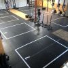 Floor grid decals for gyms, durable vinyl for safety, spacing, and heavy equipment use.