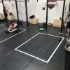 Floor grid decals for gyms, durable vinyl for safety, spacing, and heavy equipment use.