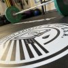 Custom weightlifting platform with gym logo decal for stability