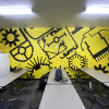 Custom wall murals for gyms, offices, or retail, with vibrant colors and branded designs.