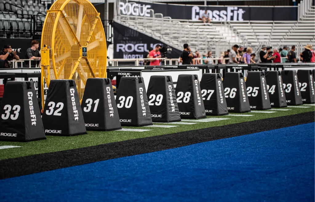 CrossFit Games event banner with athlete podium backdrop and competition branding