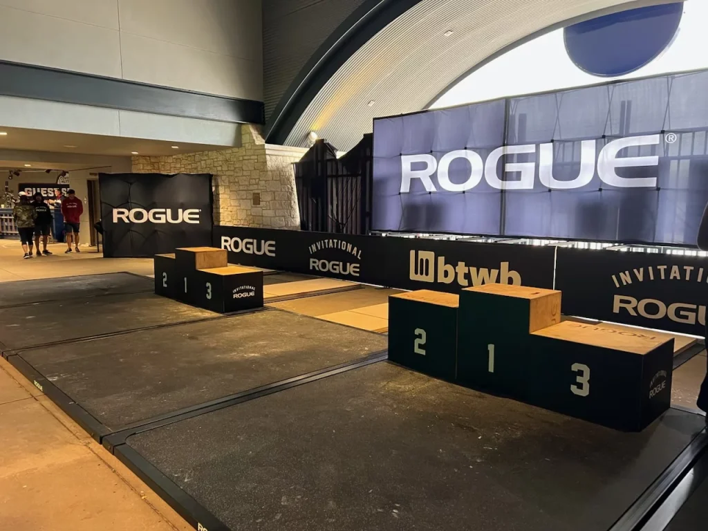 Celebrating competition with Rogue Invitational signage.